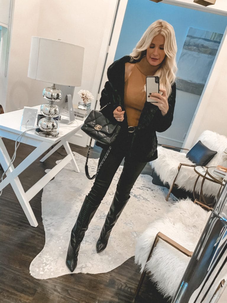 Dallas style blogger wearing a black faux fur jacket with a turtleneck sweater tank