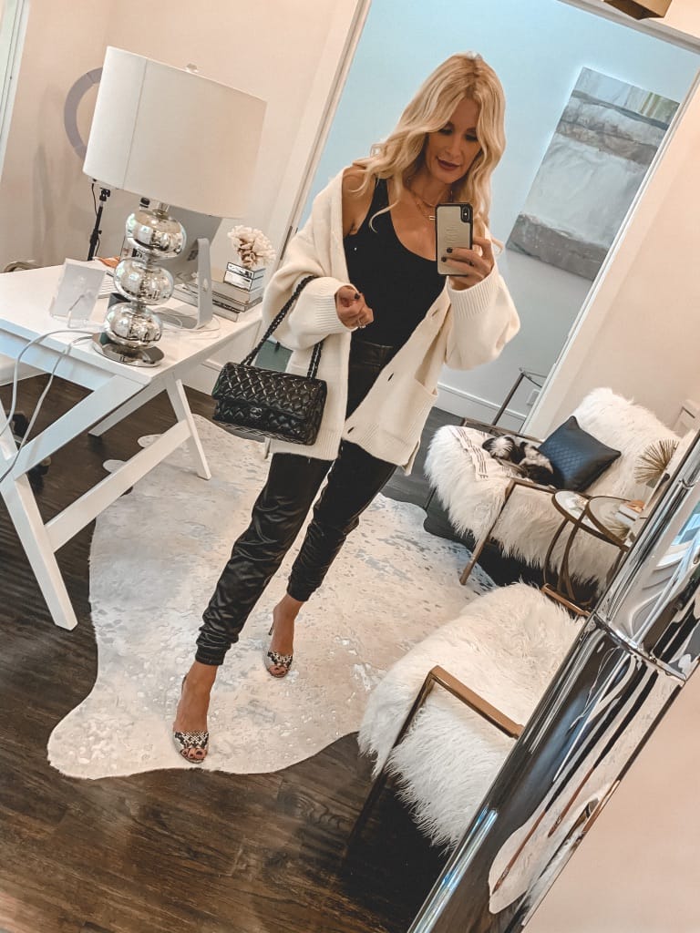 Dallas style blogger wearing faux leather pants and a white cardigan for fall and winter