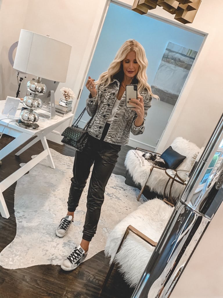 Dallas fashion blogger wearing a tiger print jacket and faux leather joggers for fall