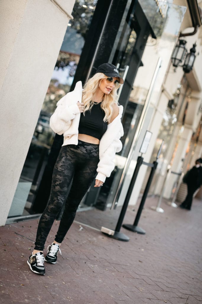 Dallas blogger wearing an affordable faux fur jacket and camo high-waist leggings 