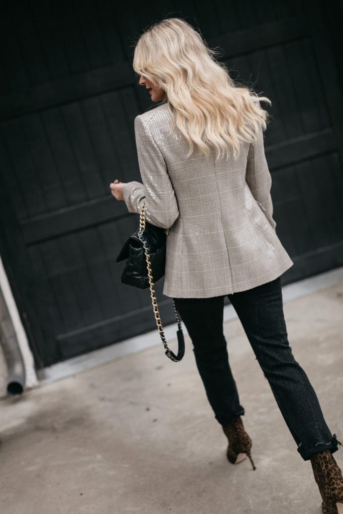 Style blogger wearing a blazer by Veronica Beard for the holidays and black denim