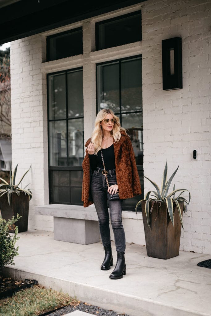 Dallas style blogger wearing faded black denim and a faux fur teddy coat