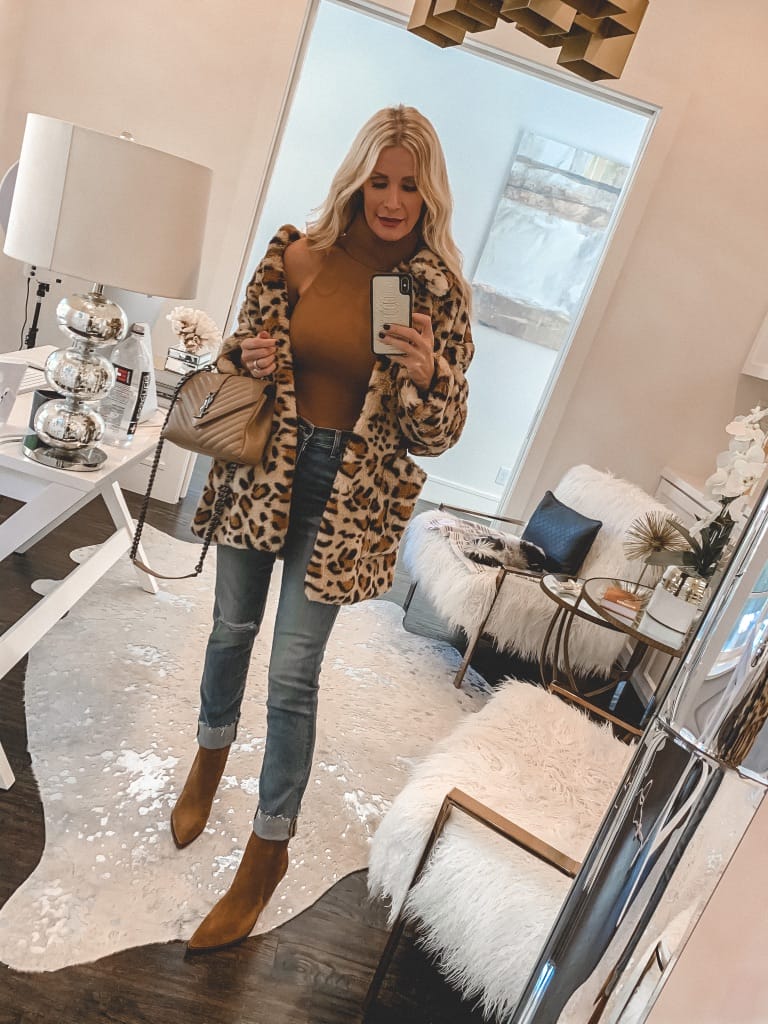 Dallas fashion blogger wearing a faux fur leopard print jacket and a turtleneck sweater 