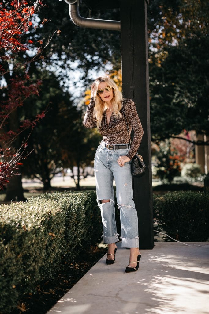 Dallas blogger wearing Moussy jeans and a leopard bodysuit