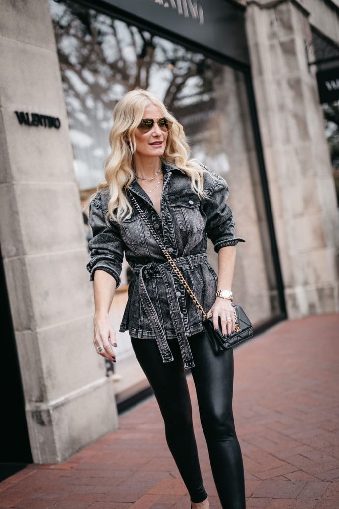Dallas blogger wearing a black denim jacket and faux leather leggings