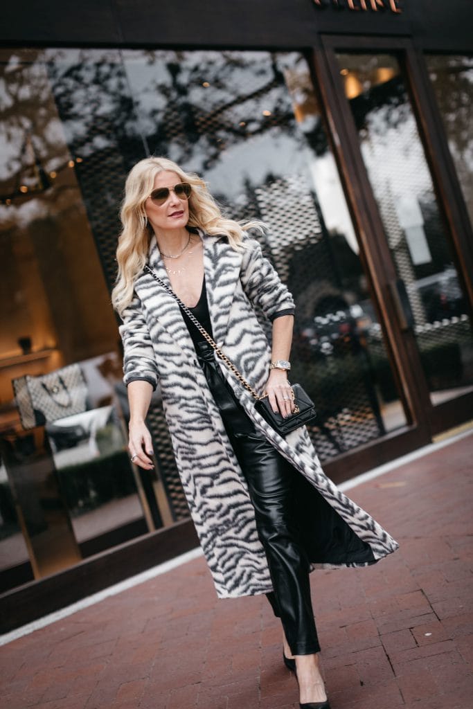 Dallas blogger wearing a long coat and faux leather pants