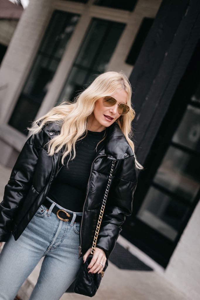 Dallas style blogger wearing a black bodysuit and a black puffer jacket for winter 