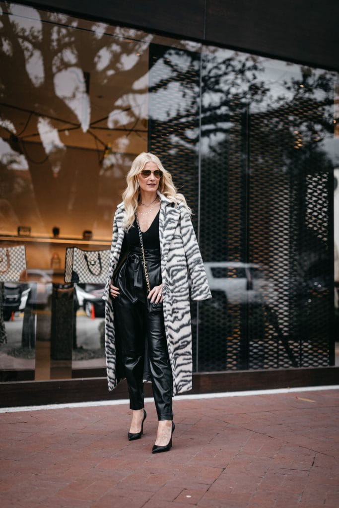 Dallas blogger wearing a black and white coat and faux leather pants
