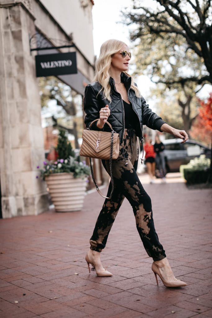 Dallas blogger wearing an affordable leather bomber jacket and chic joggers with heels