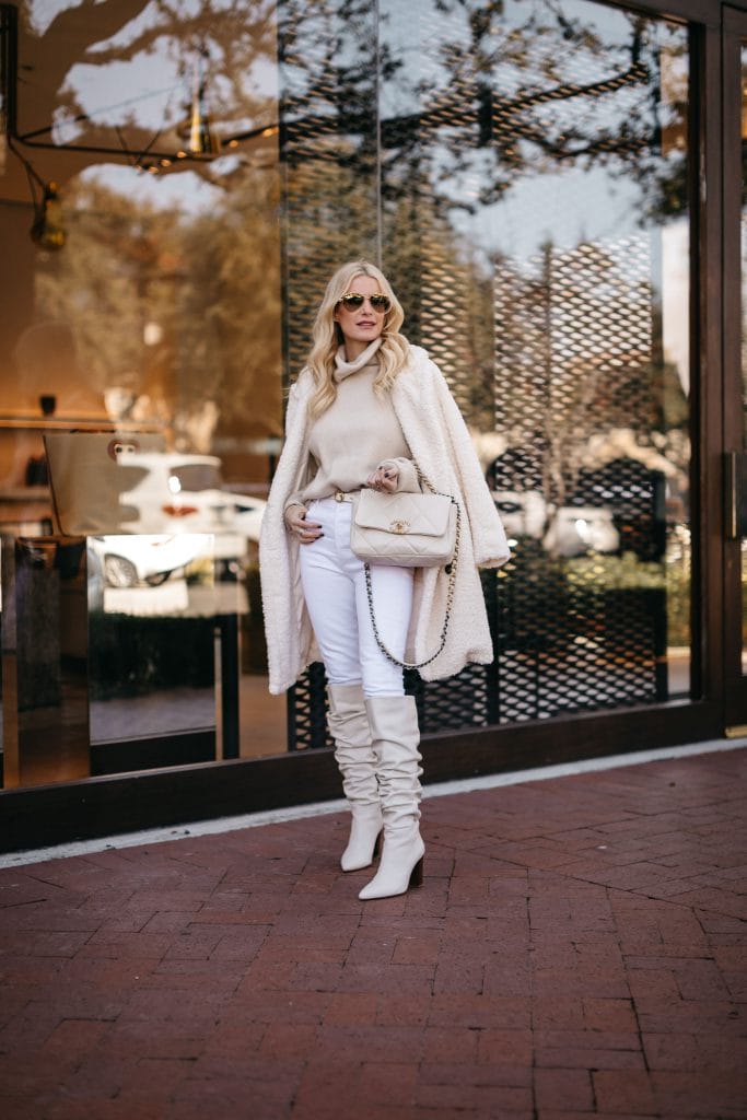 Dallas blogger wearing a winter white outfit and a white teddy coat