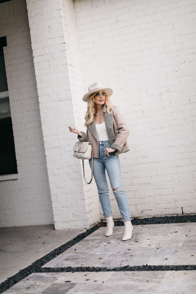 So Heather Blog wearing light wash denim and white booties for a neutral spring look