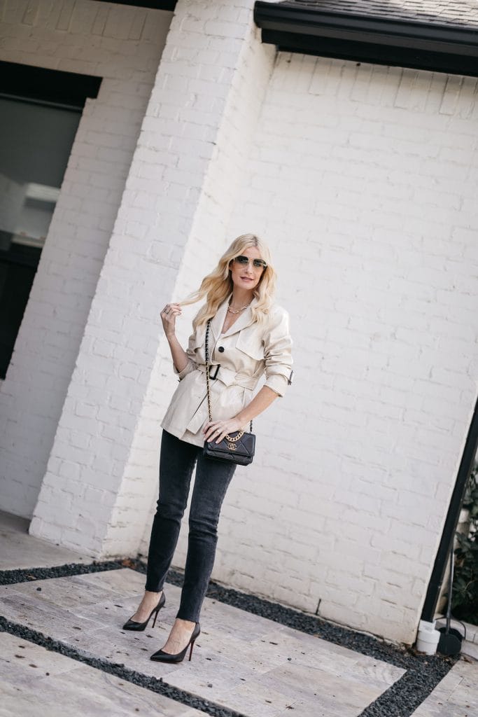 Dallas fashion blogger wearing a belted trench jacket and black denim