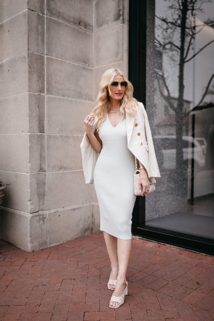 Dallas blogger wearing a white bodycon dress and a white blazer for spring