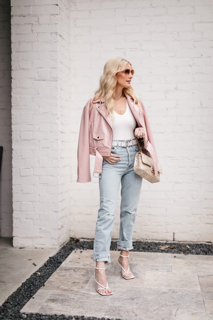 Dallas blogger wearing light wash straight leg jeans and white sandals