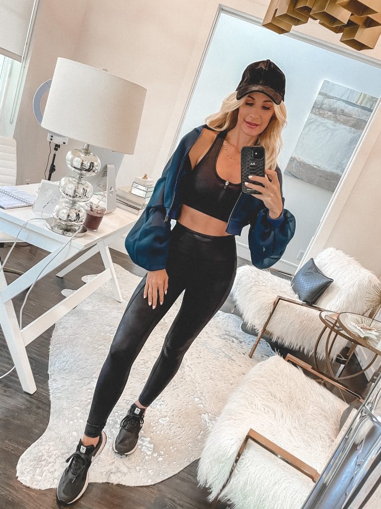 Dallas style blogger So Heather blog wearing a black workout set and a blue jacket for staying fit
