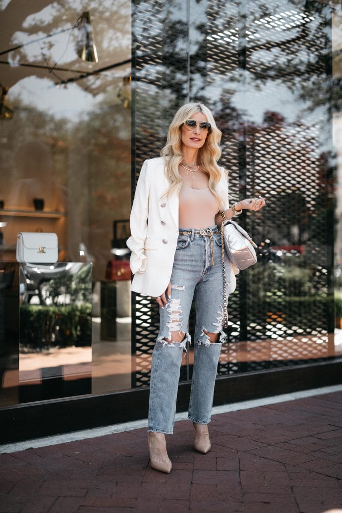 Dallas fashion blogger wearing distressed denim and a white blazer