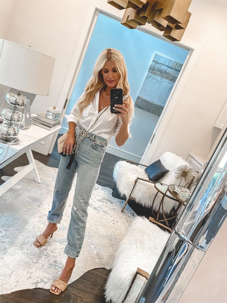 Style blogger wearing Agolde denim and a tucked in white button-down top