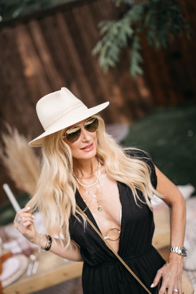 Dallas blogger wearing a black swimsuit cover-up