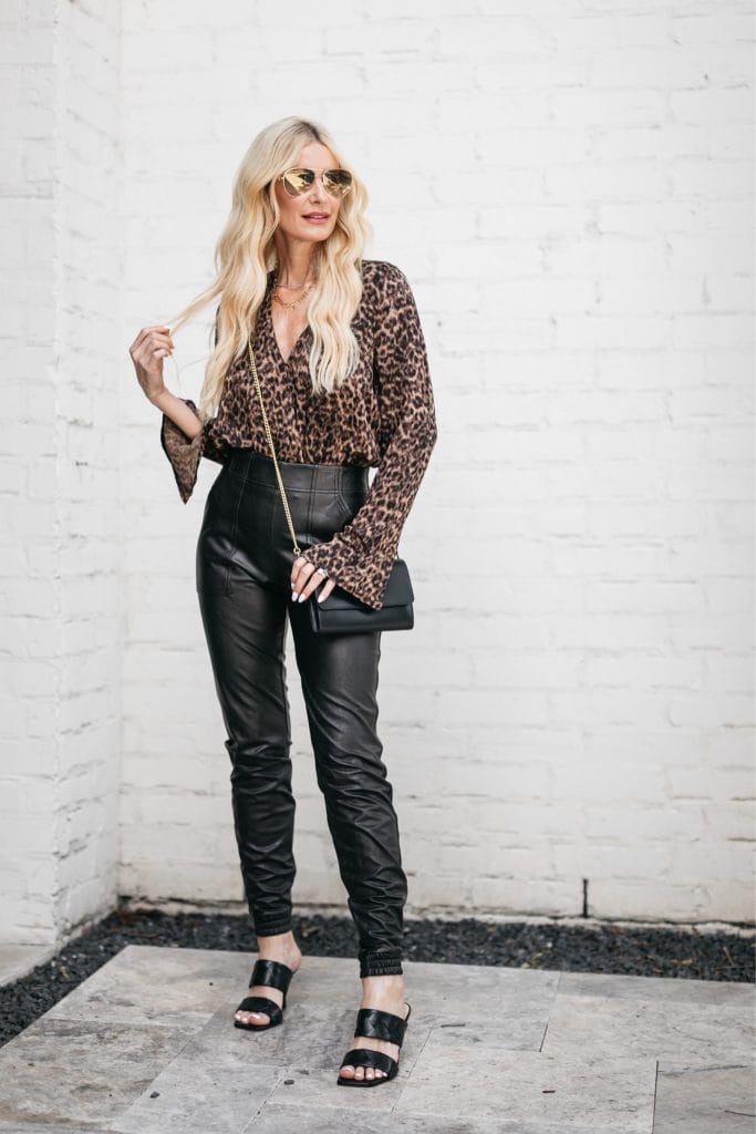 Dallas blogger wearing a leopard print bodysuit and faux leather joggers