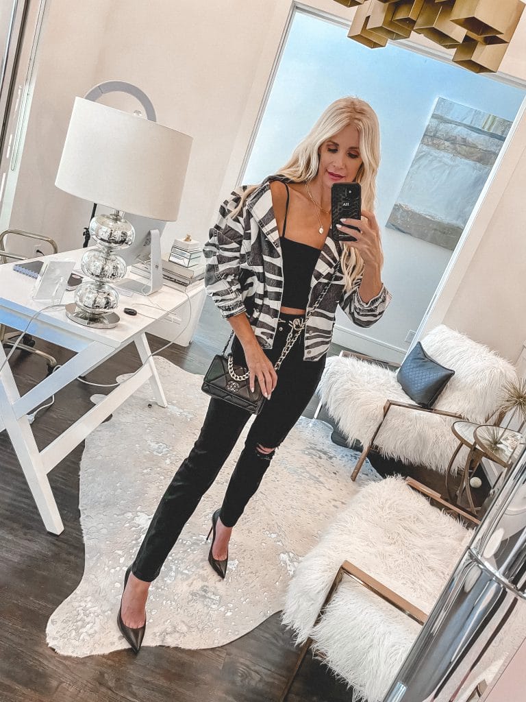 Dallas blogger wearing a zebra print jacket and black denim