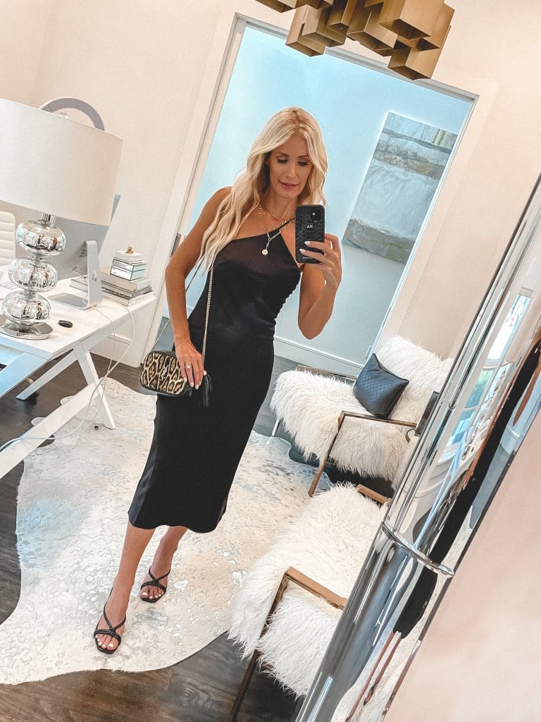 Dallas fashion blogger wearing a black midi dress and black sandal heels