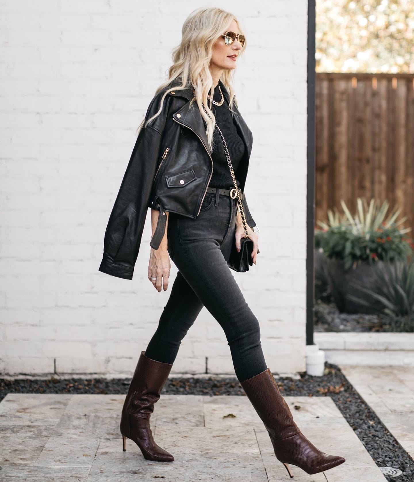 Dallas fashion blogger wearing a black leather jacket and black denim