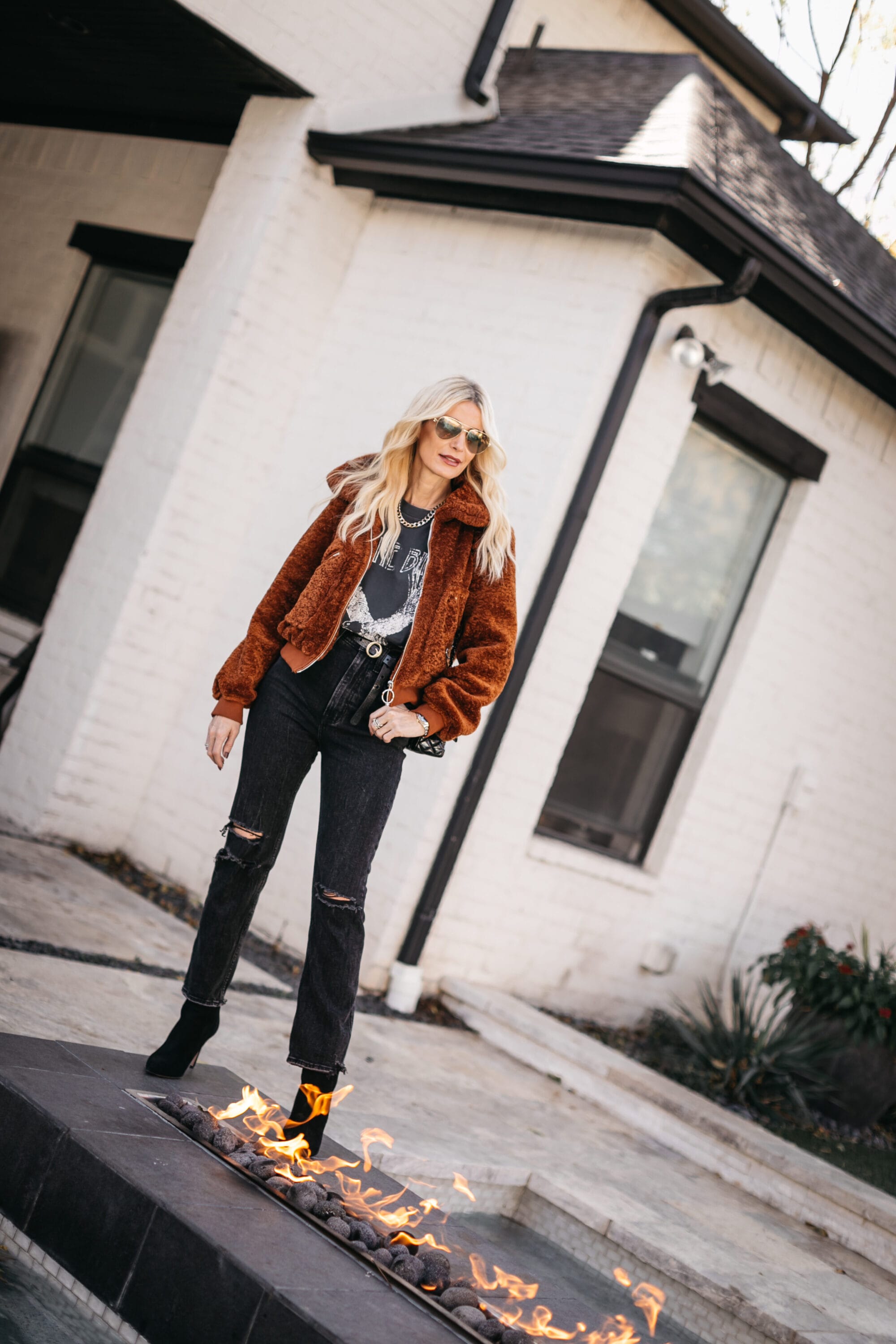 Dallas fashion blogger wearing a faux fur jacket and black denim
