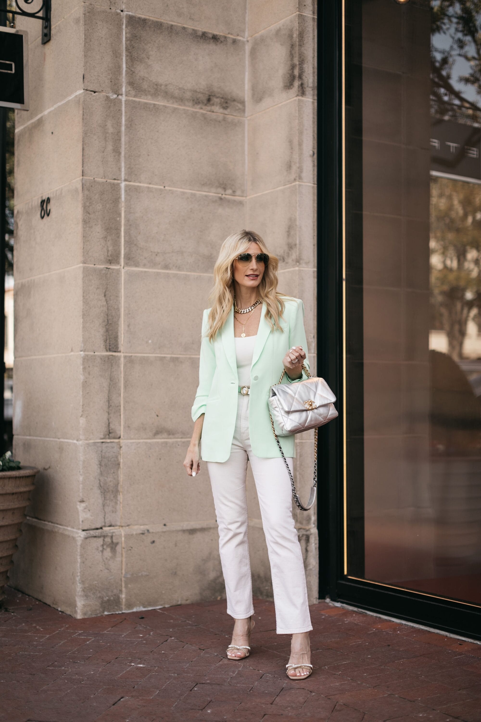 Dallas fashion blogger over 40 wearing oversized mint blazer over white denim and white bodysuit