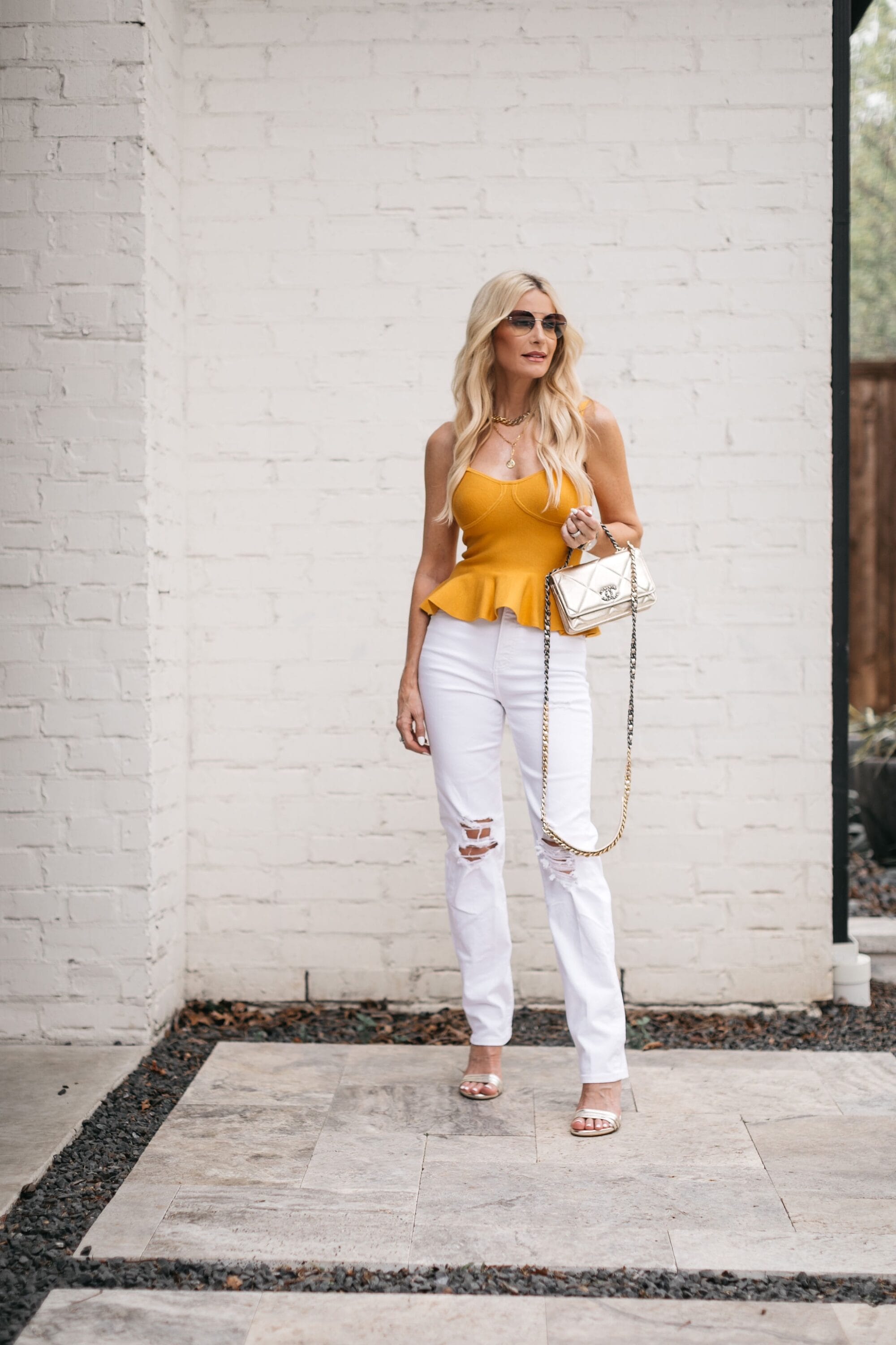 Dallas fashion blogger over 40 wearing white straight leg jeans- a summer 2022 trend