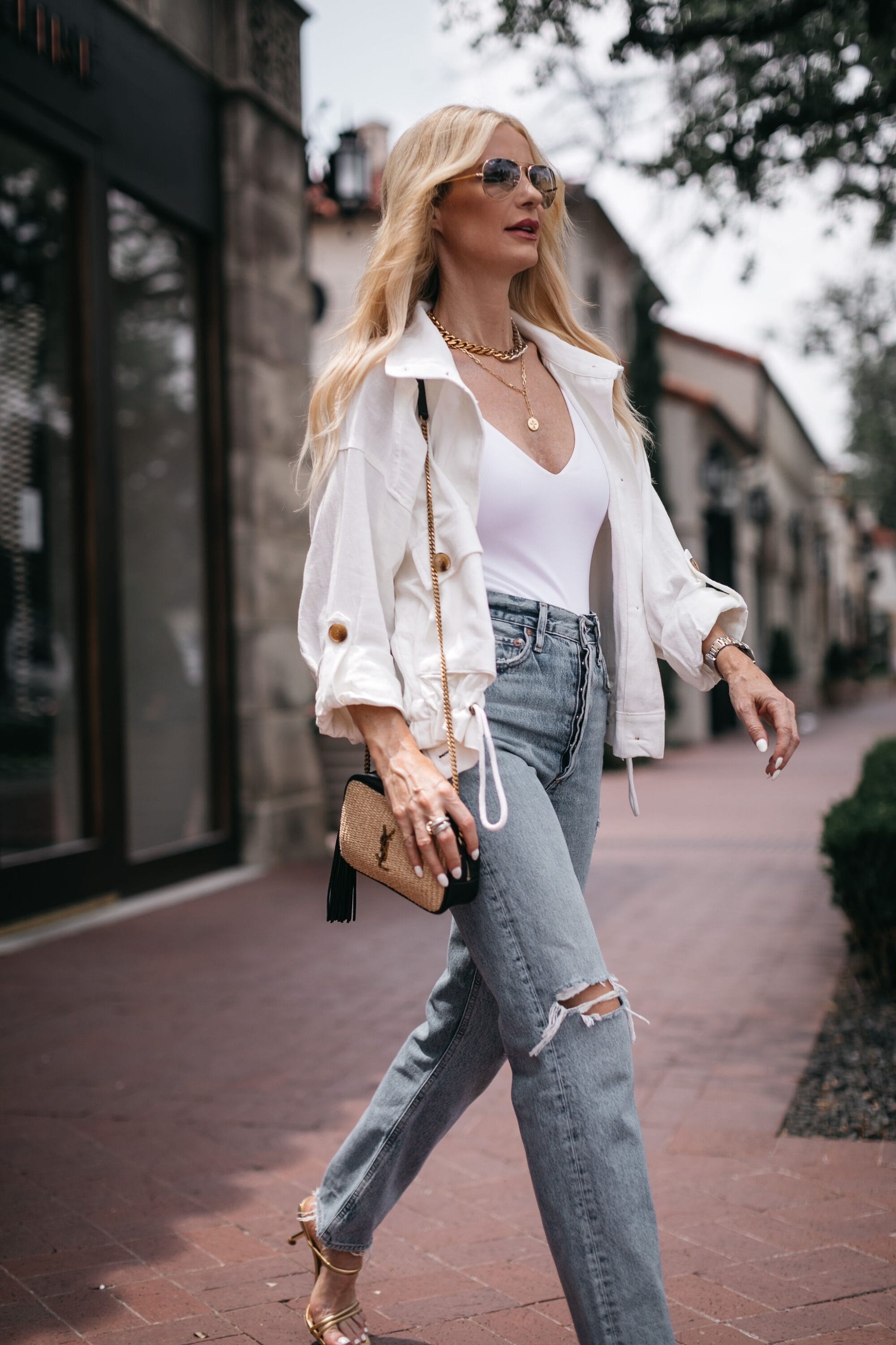 Dallas fashion blogger wearing light white cotton jacket, skims body suit and straight leg denim