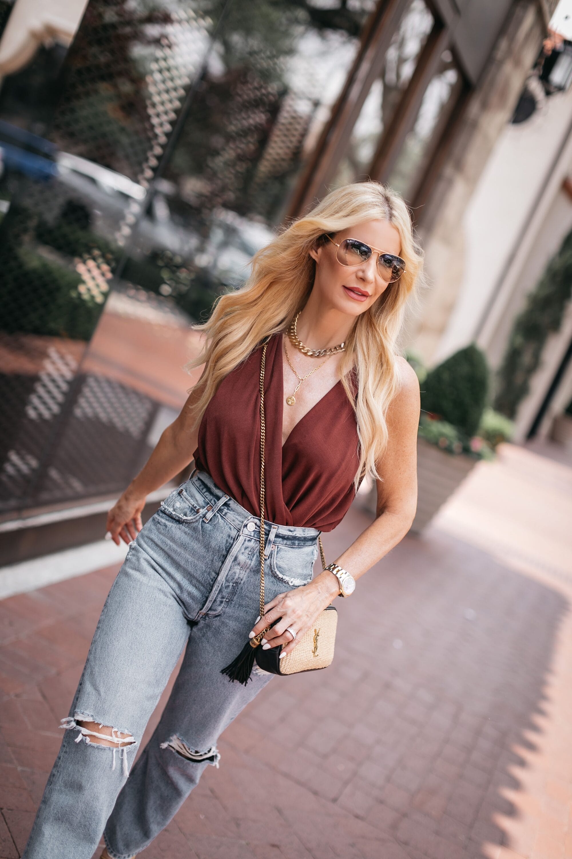 Dallas fashion blogger wearing summer date night look free people bodysuit, straight leg denim and gold accessories 