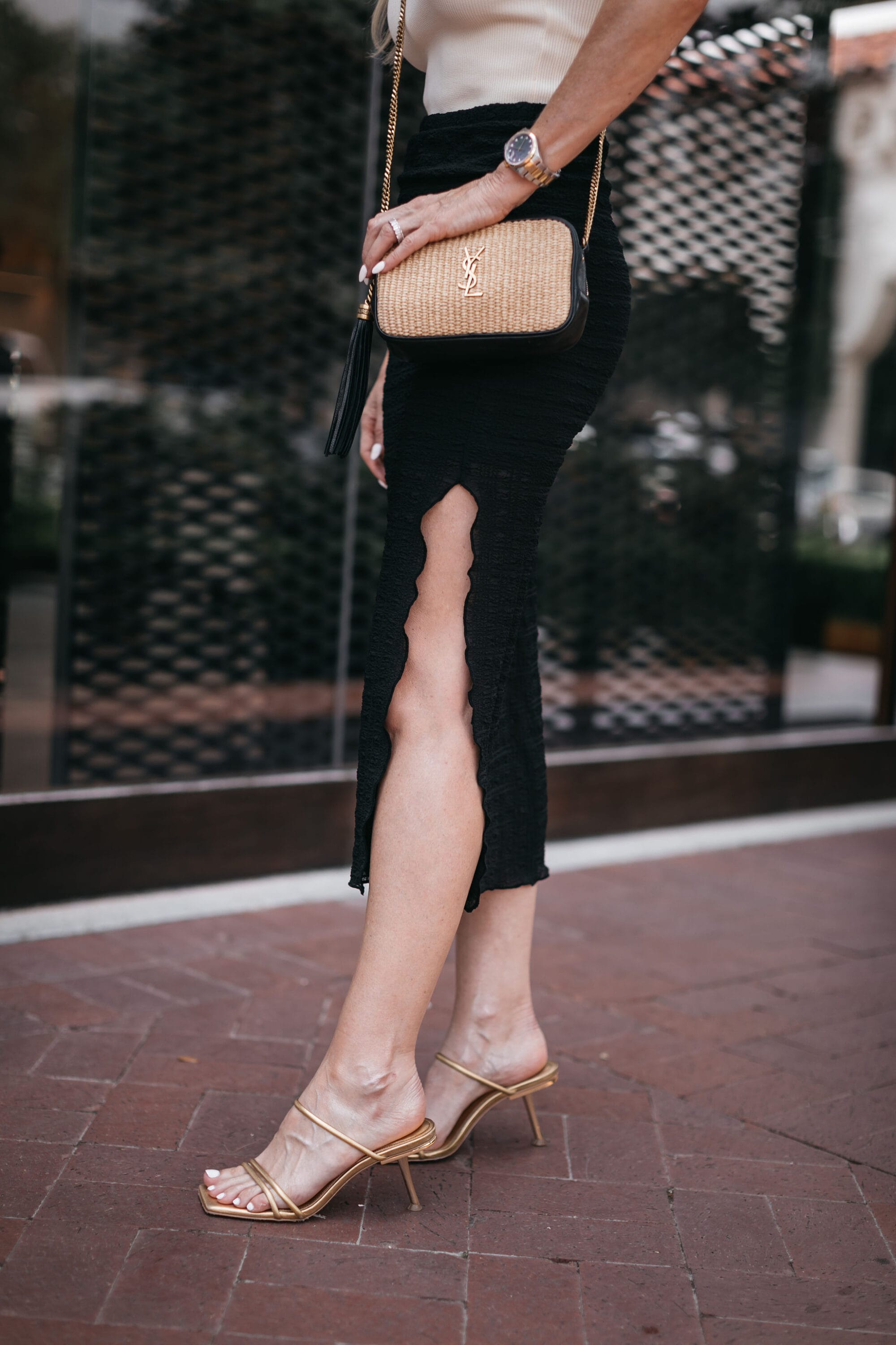 Dallas woman over 40 wearing gold metallic heels