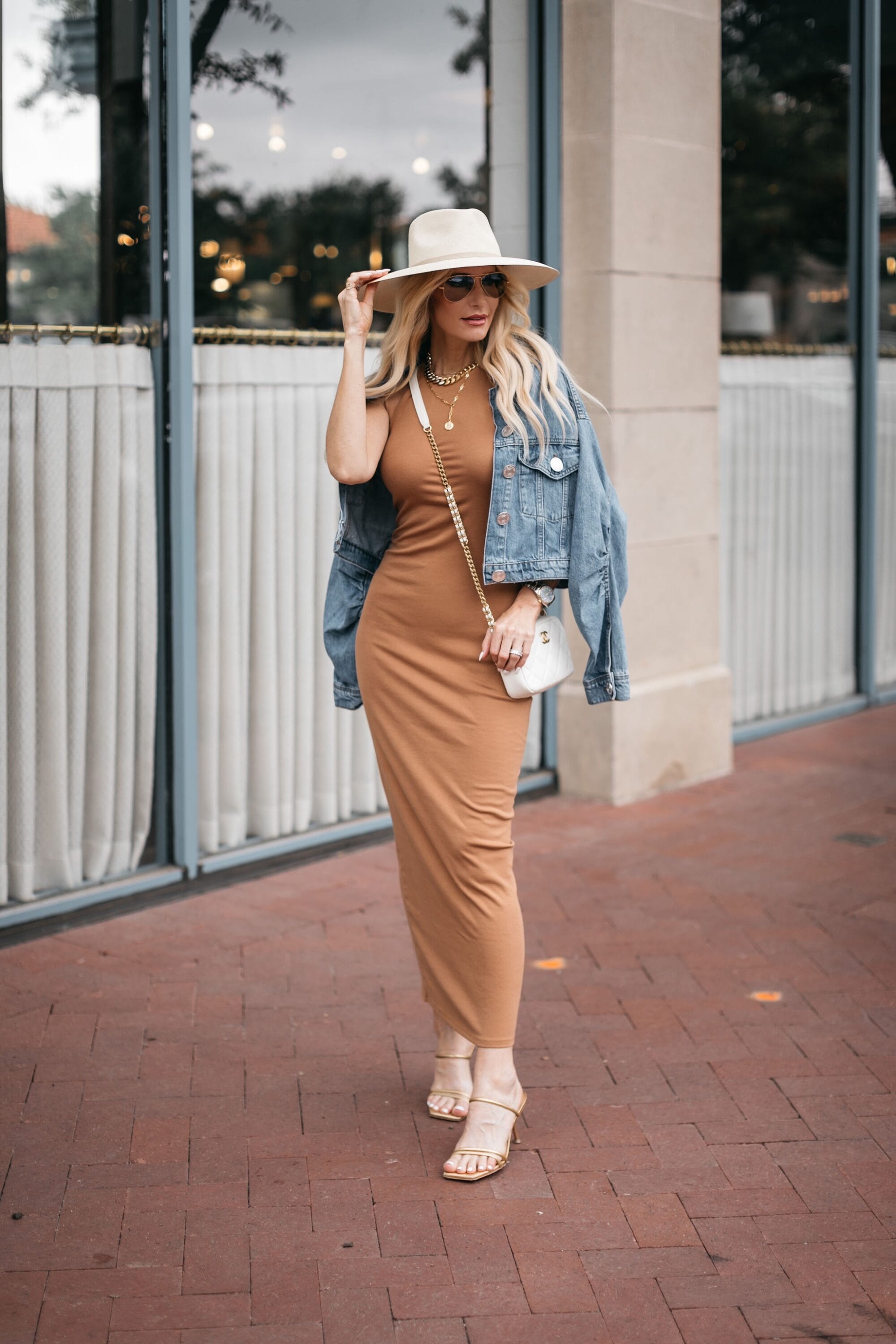 Dallas fashion blogger showcasing how to style a summer hat with camel maxi dress and denim jacket
