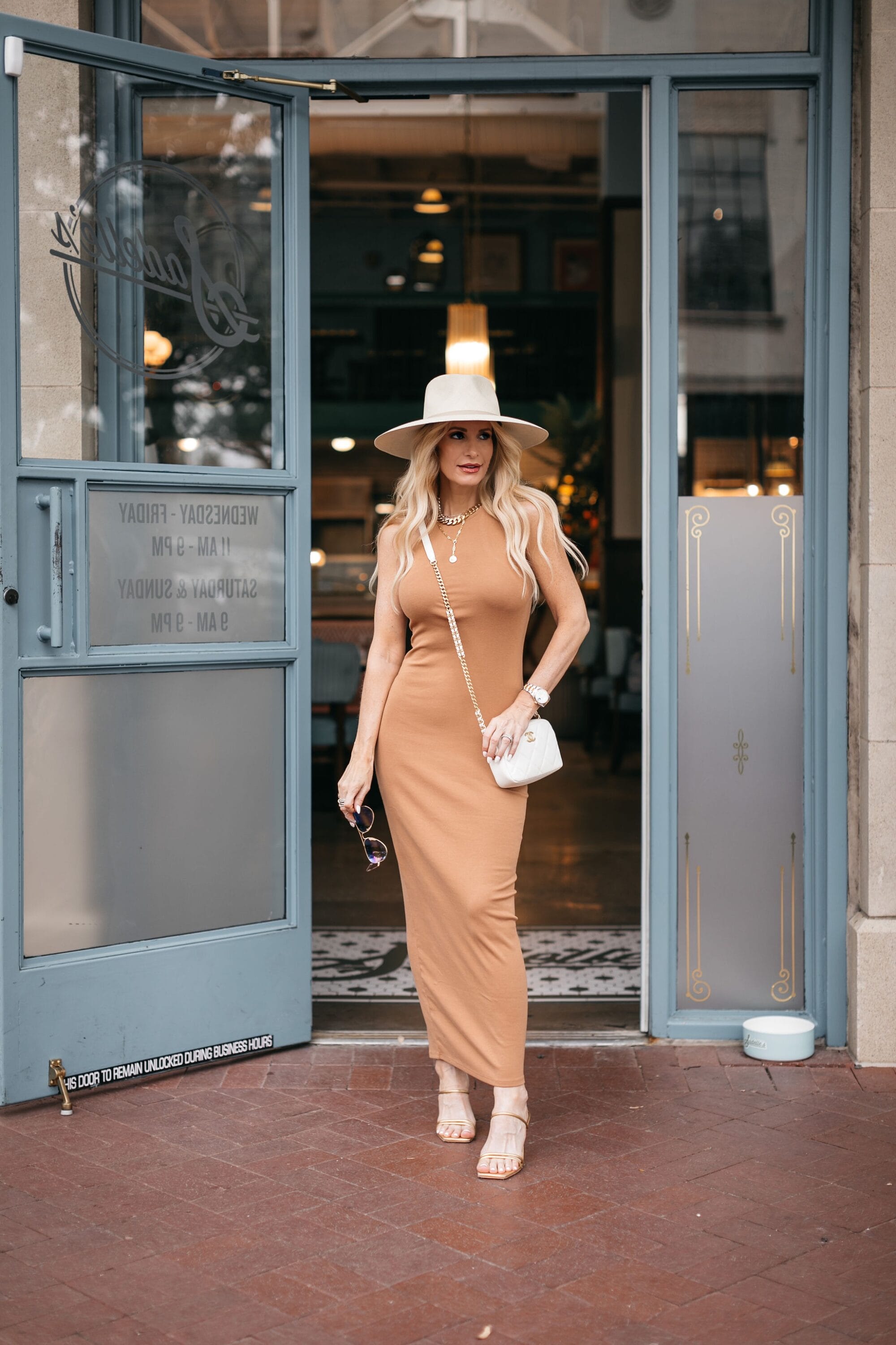 Dallas fashion blogger wearing panama wide brim hat with camel maxi dress