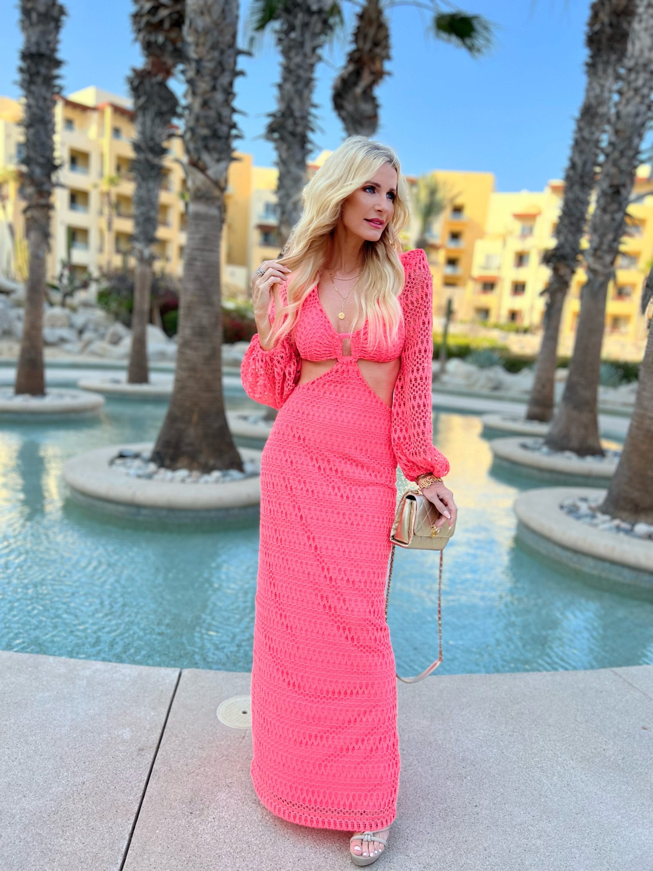 Dallas fashion blogger wearing pink crochet cut out maxi dress as example of chic vacation looks