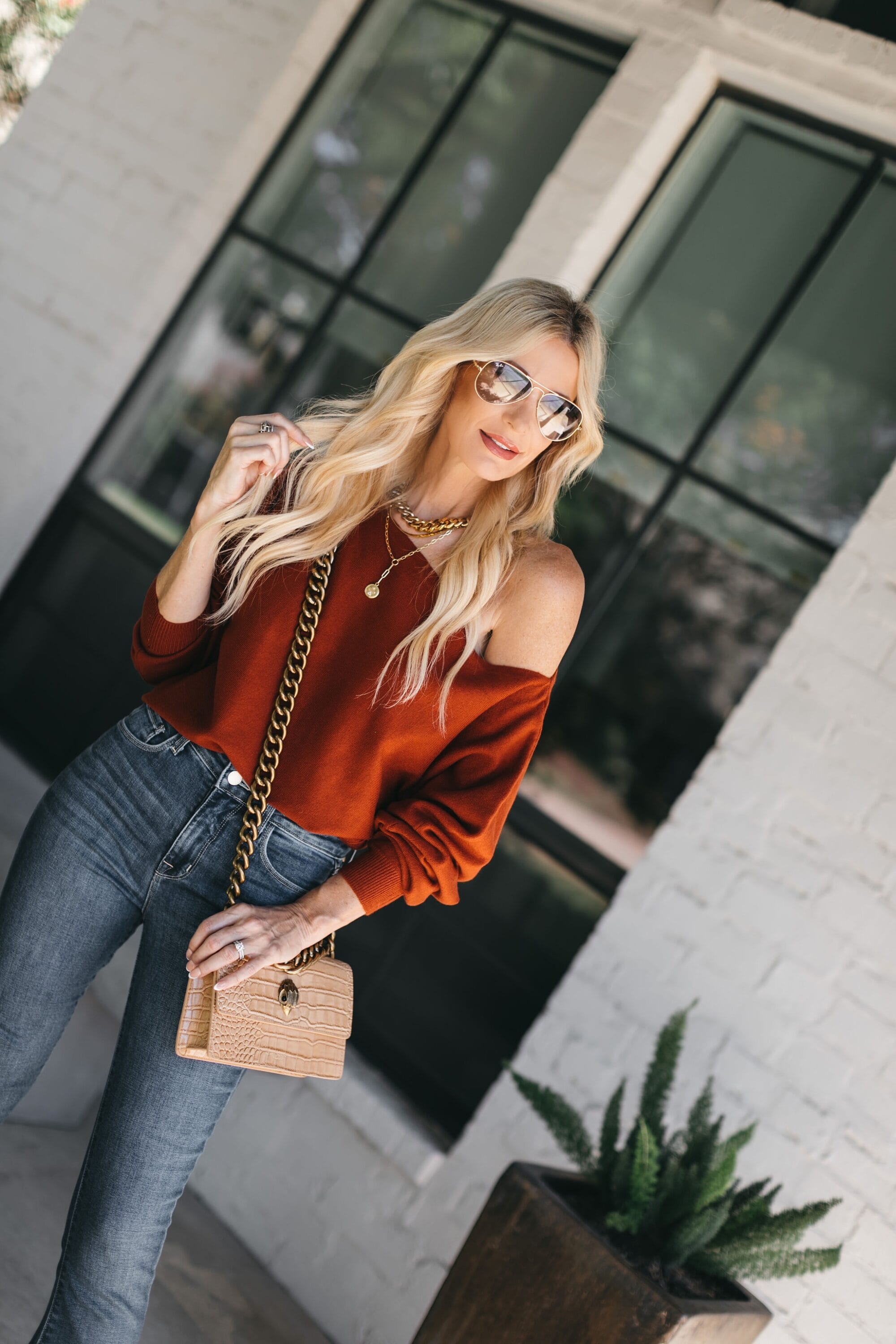 Dallas fashion blogger over 40 wearing rust colored one shoulder sweater from Nordstrom anniversary sale