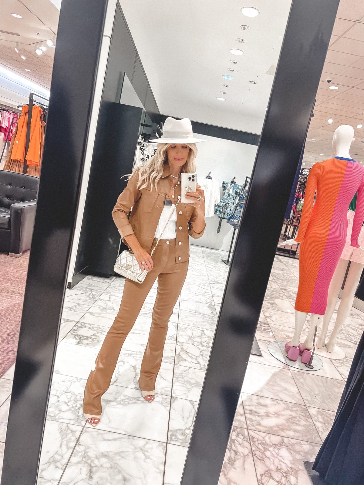 Dallas woman over 40 wearing camel faux leather flares and tan jacket as one of Nordstrom Anniversary Outfits 2022