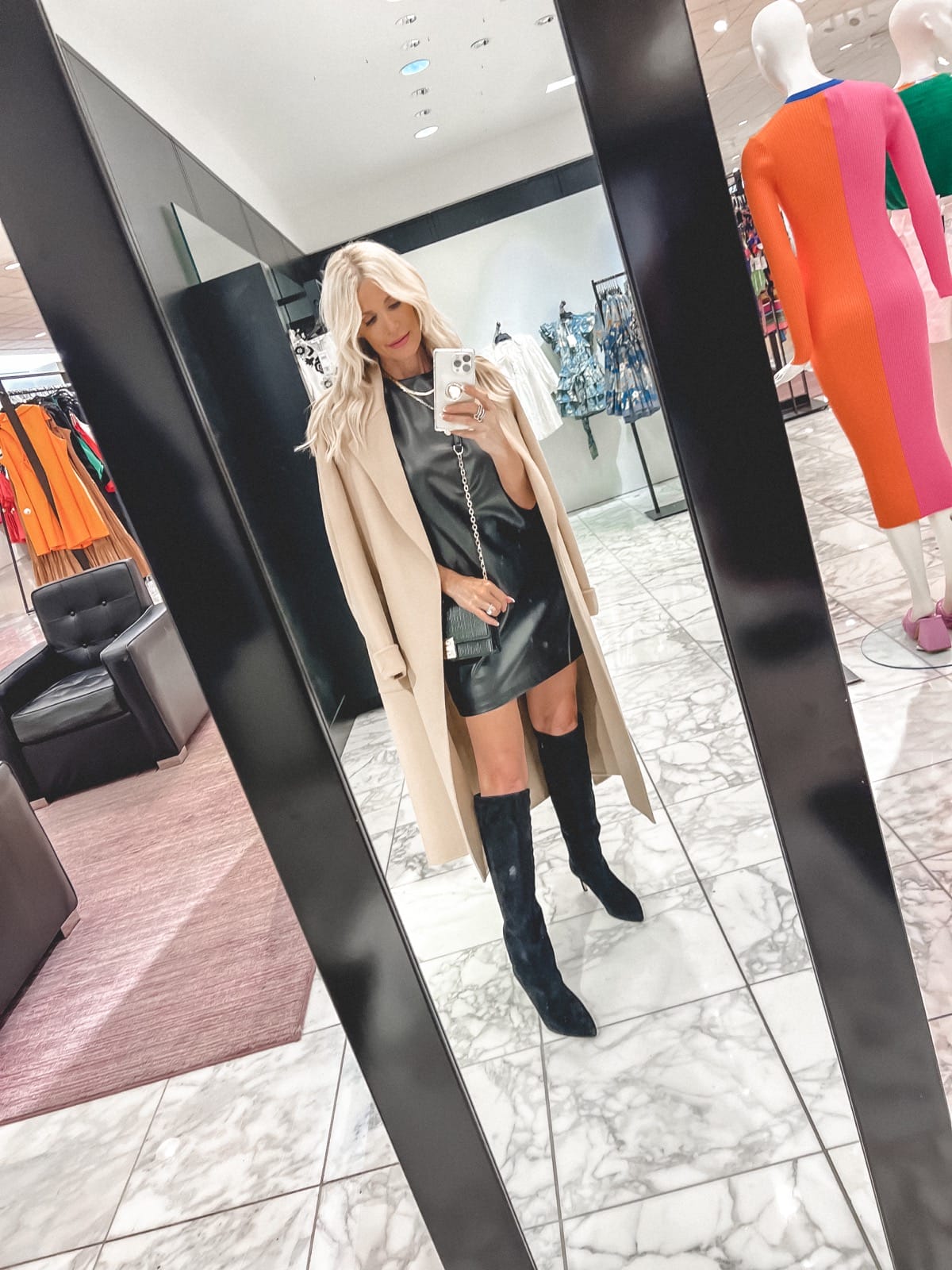 Over 40 Dallas fashion blogger wearing faux leather dress, veronica beard boots and camel jacket