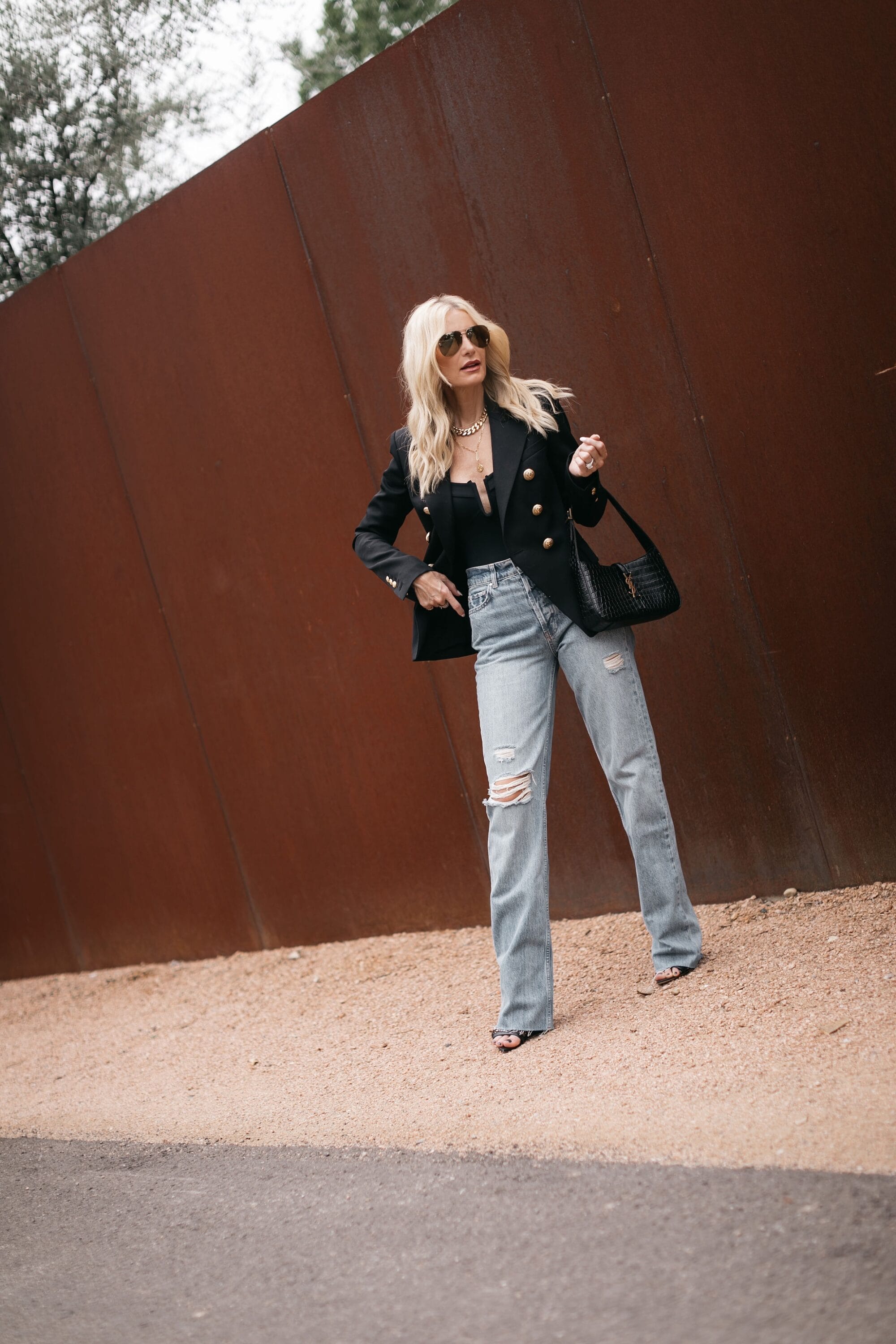 Dallas fashion blogger over 40 showing 5 different options for how to wear baggy denim.