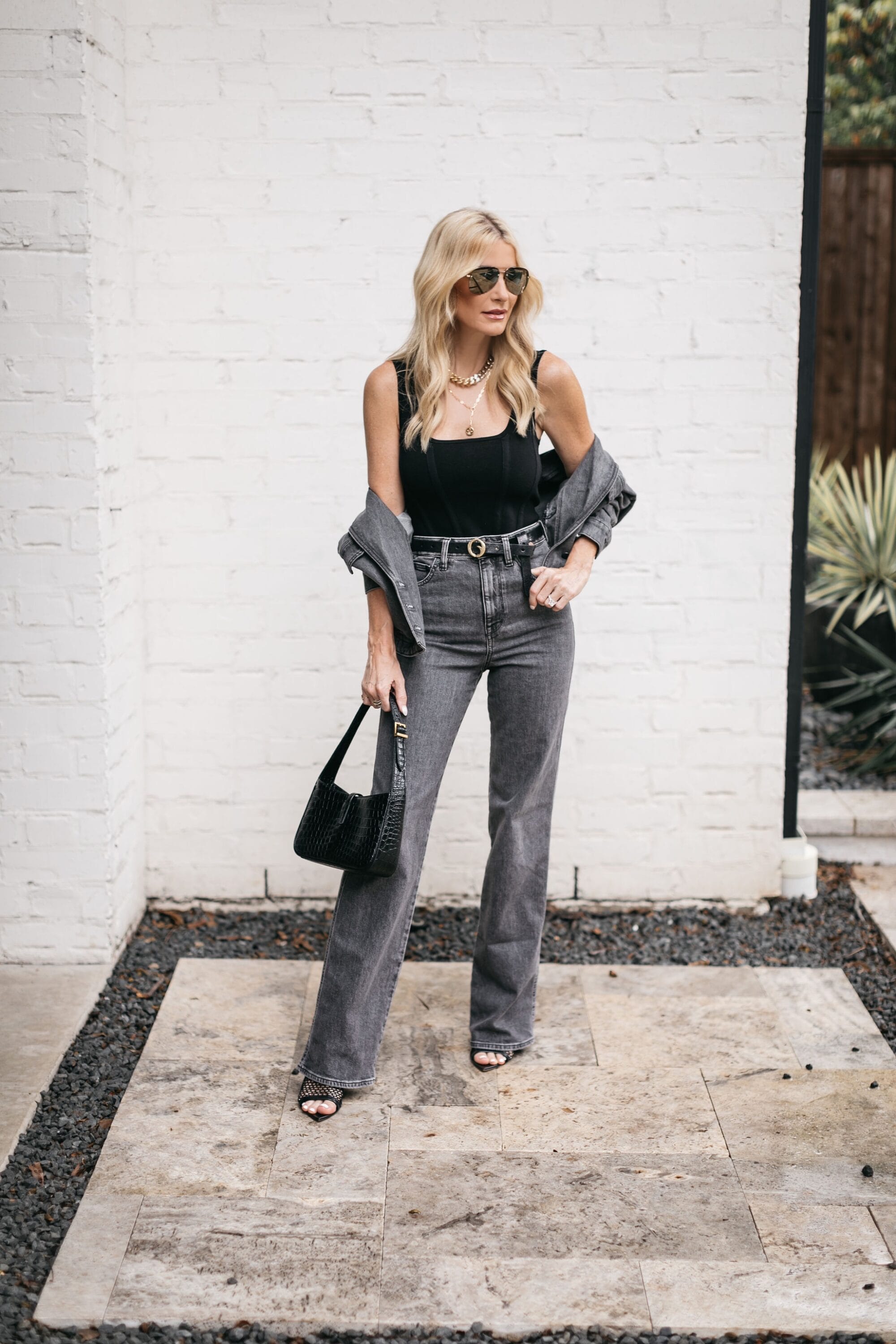 Dallas fashion blogger wearing Clinch belt with express X Simon Spurr collab denim as example of luxury pieces worth the investment.