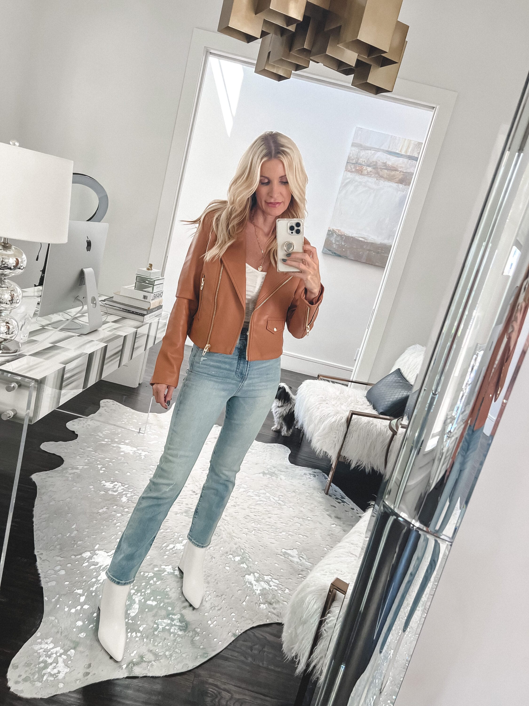 Dallas fashion blogger wearing slim fit express jeans with white pointed toe leather bootie as on of the best fall boots of 2022.