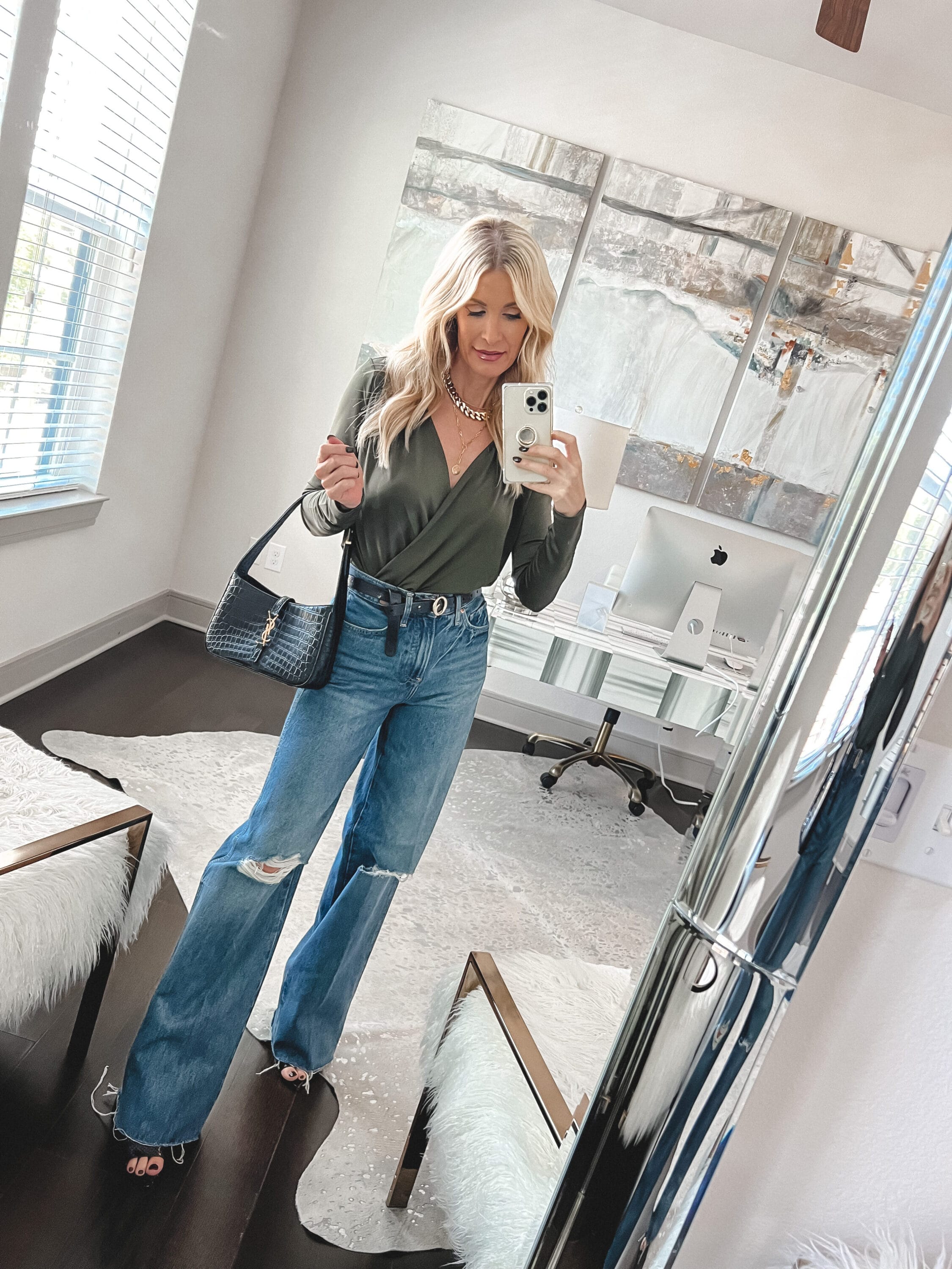 Dallas fashion blogger over 40 wearing baggy denim trend with under $100 bodysuit.
