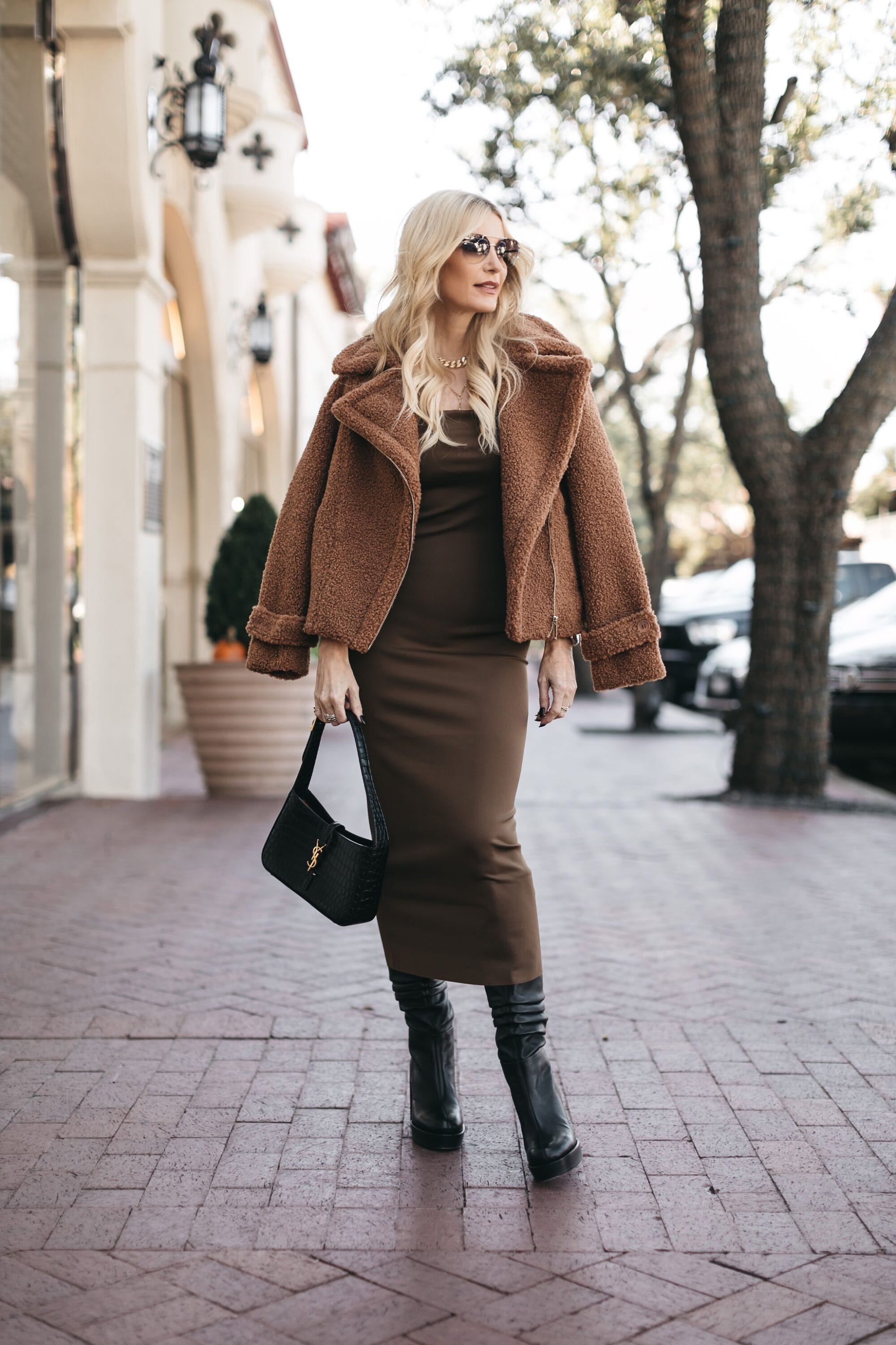 Dallas fashion blogger wearing brown midi dress as one of the best selling items in November 2022.