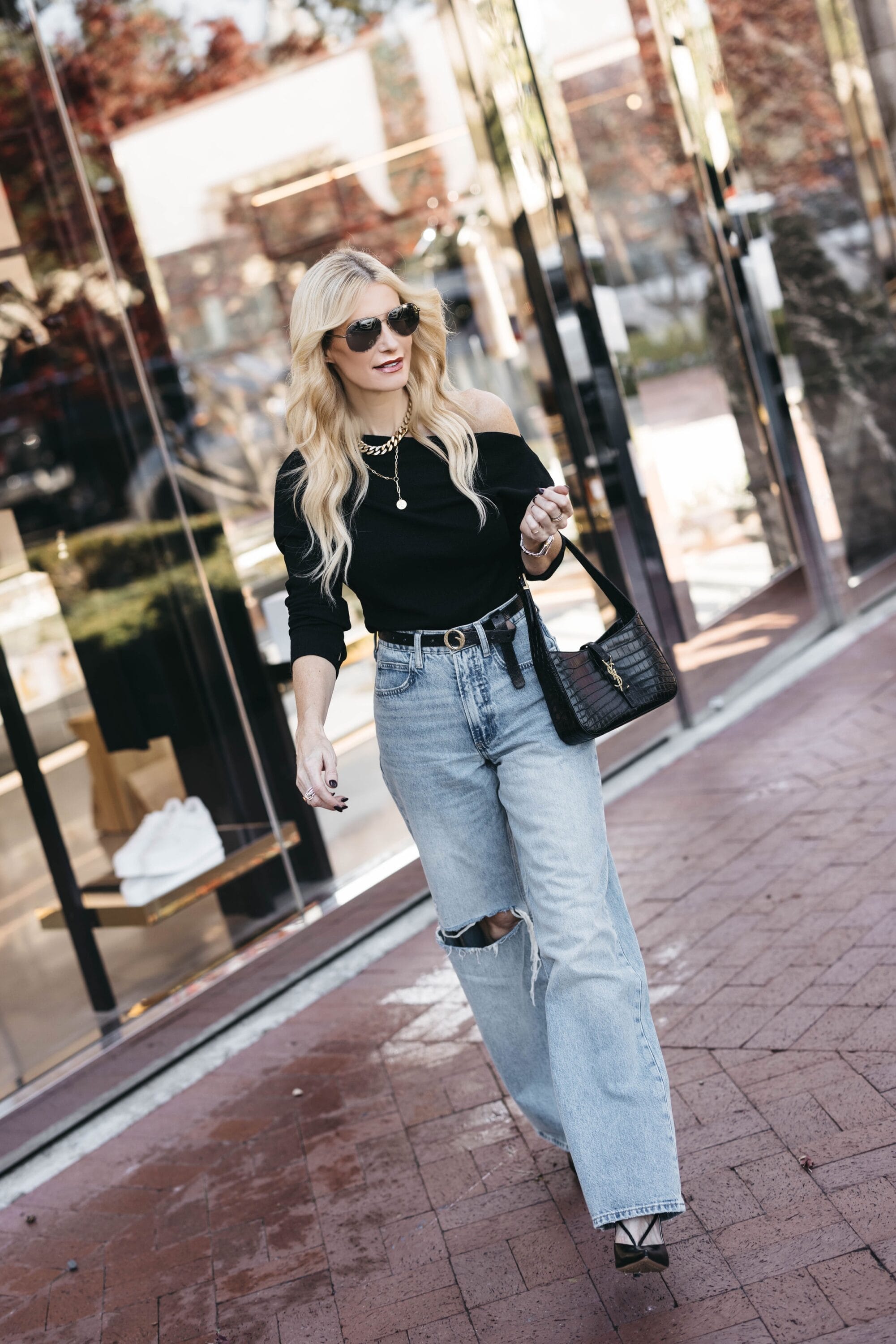 Dallas fashion blogger over 40 showcasing how to style baggy denim.