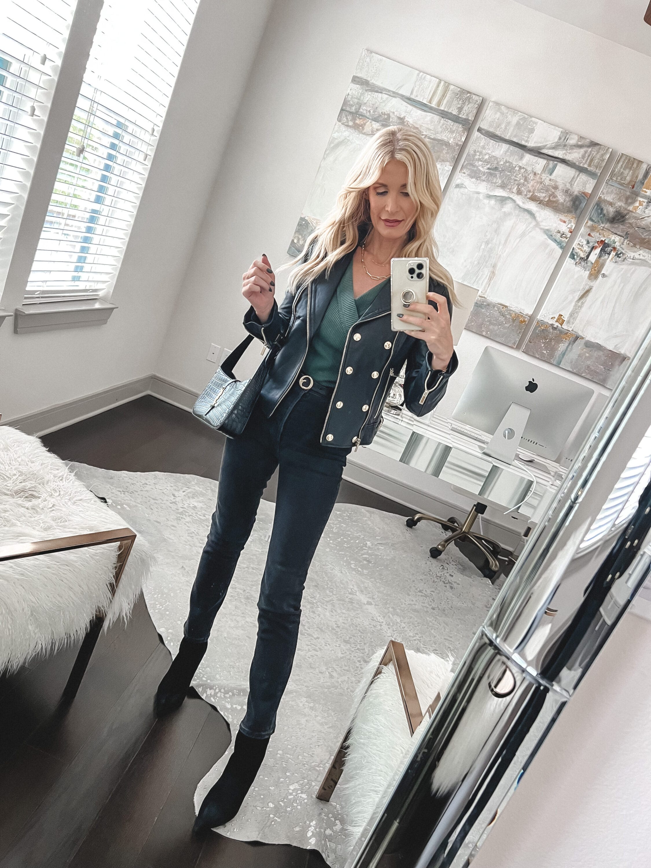 Fashion influencer over 40 wearing military leather jacket with gold hardware as one of the best winter jackets your wardrobe needs.