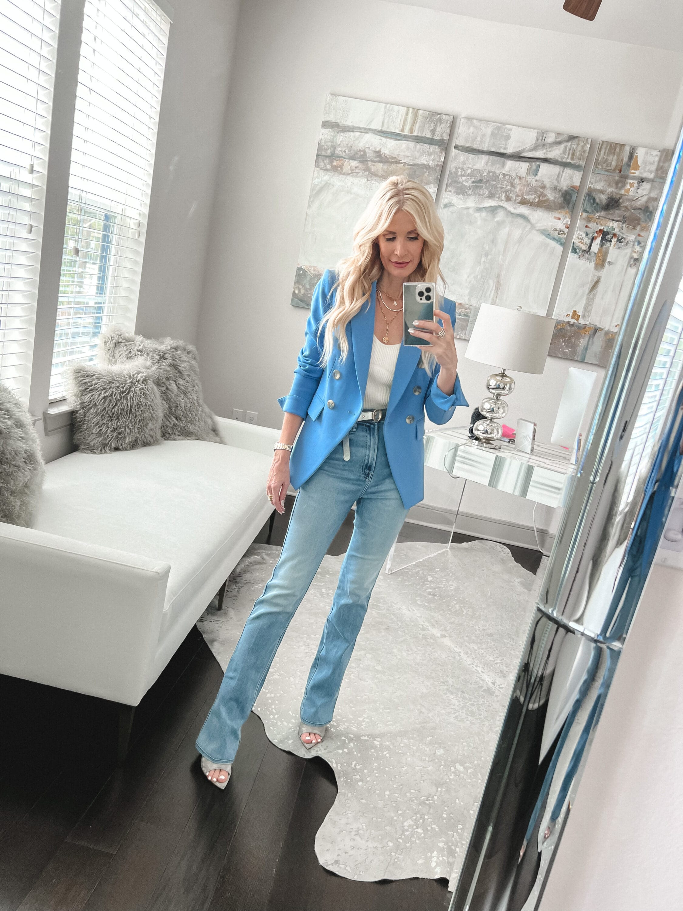 Over 40 fashion influencer from Dallas wearing blue Veronica Beard Miller jacket with light wash denim and white top.