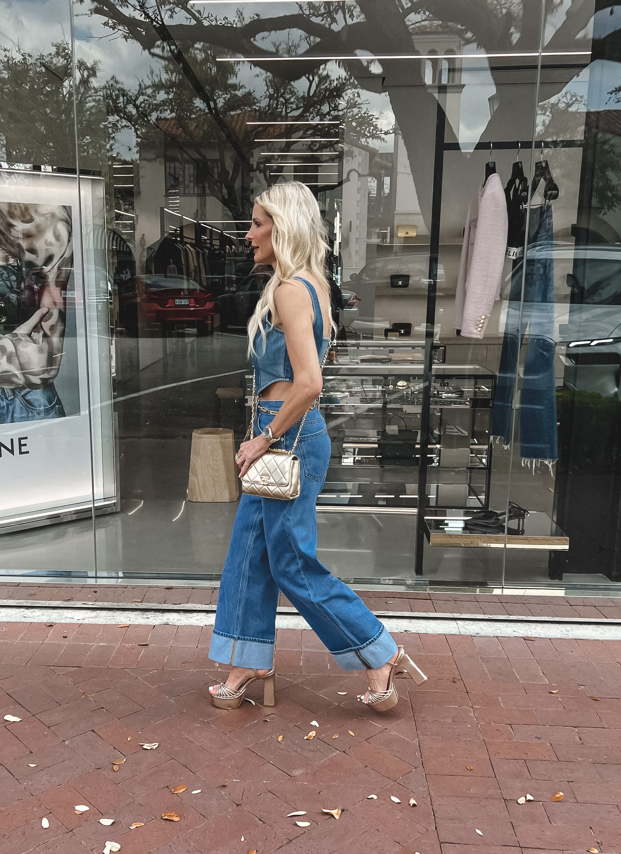 Over 40 fashion blogger wearing wide leg denim as one of the top spring denim trends of 2023.