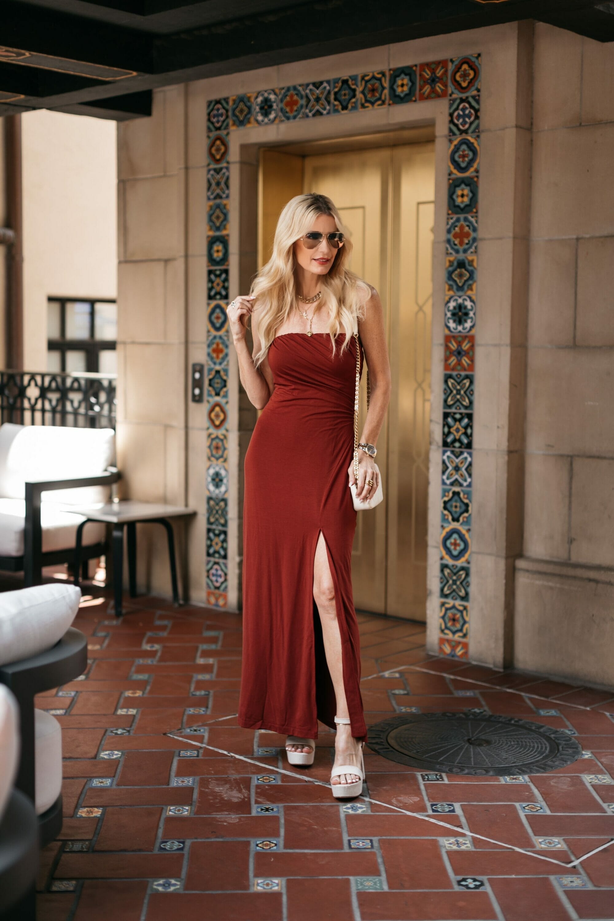 Dallas over 40 fashion influencer wearing red maxi dress with platform heels.