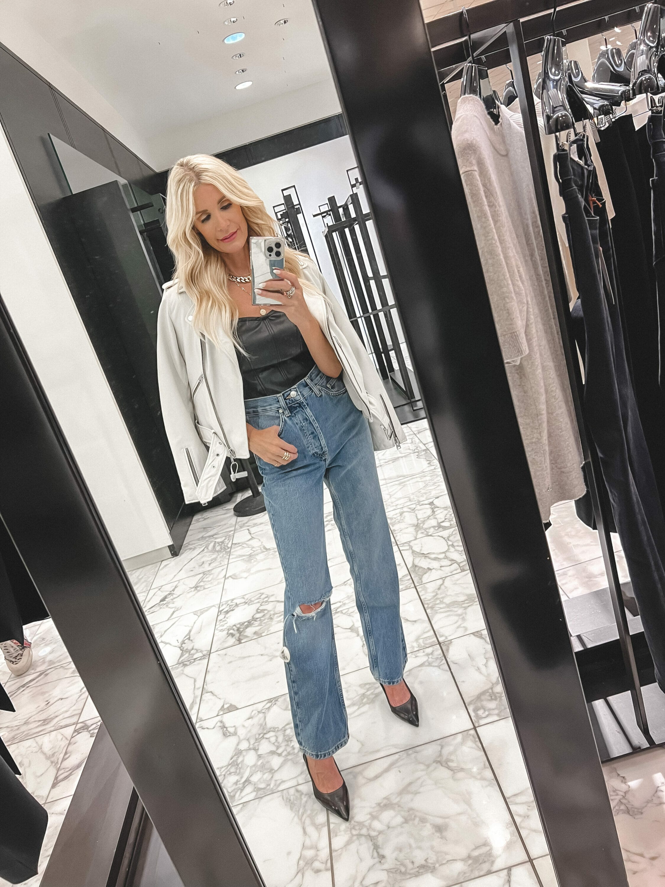 Dallas woman over 40 wearing leather jacket over straight leg jeans as one of the best pieces from the nordstrom anniversary sale still in stock