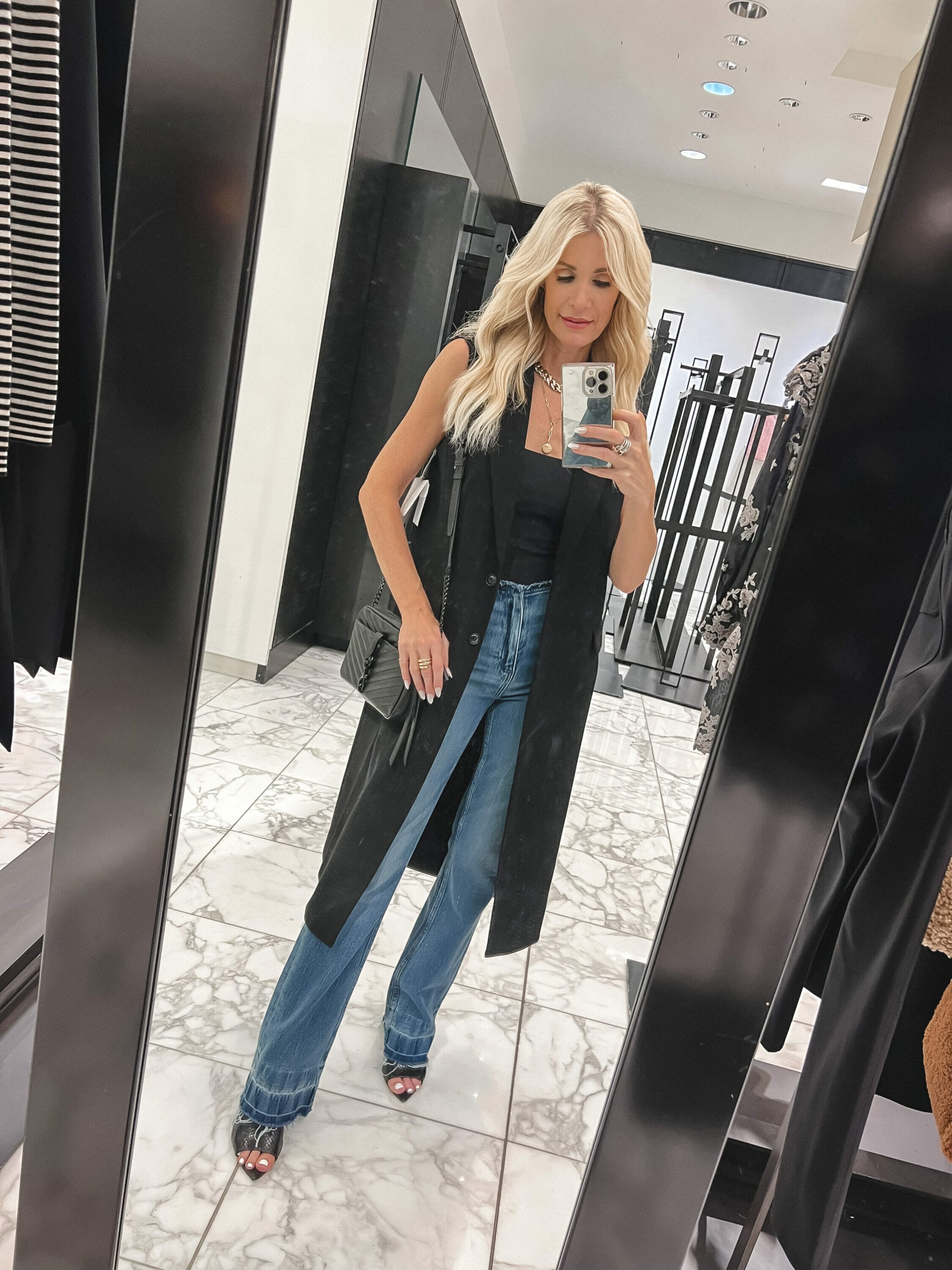 Dallas fashion blogger wearing long vest with boot cut jeans as one of the best under $100 pieces from the Nordstrom Anniversary Sale.